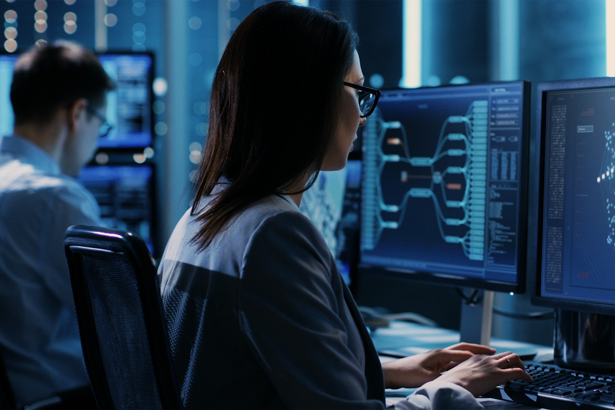 woman sitting at desk working counterintelligence jobs